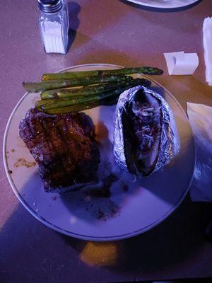 Steak, baked potato, asparagus.