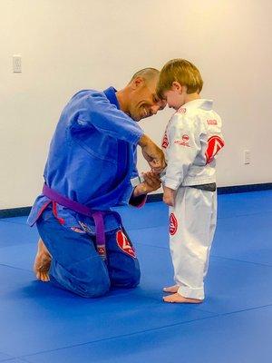 Coach Paul awarding a stripe.