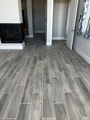 Doug replaced the carpet in the master bedroom with porcelain tiles.