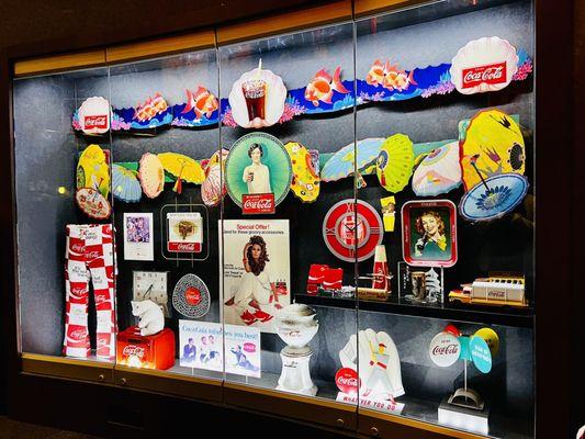 Coca-Cola memorabilia...the eldest is the dispenser at the bottom middle