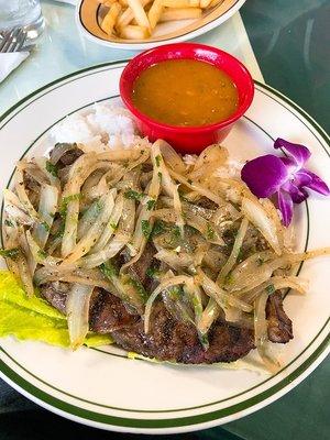 Rib eye steak with onion sauce