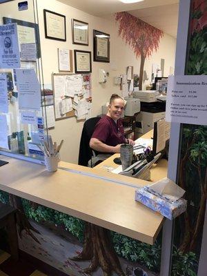 The happiest front desk receptionist