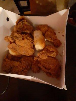 Burnt up order of chicken which is missing pieces