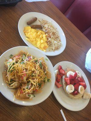 Zesty nachos, sausage, hashbrowns, and banana strawberries on blueberry pancakes.