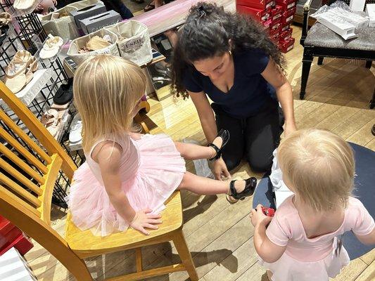 3-year old getting fitted for her first pair of tap shoes