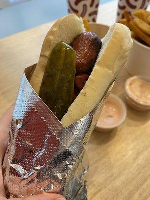 Polish dog with a pickle and special sauce