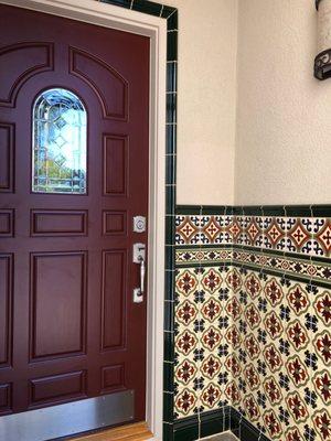 Expert craftsman Fred did an awesome job installing wainscoting inside the entry portico especially in matching tile designs in the corners.