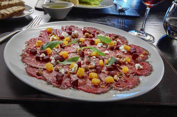 Beef Carpaccio with heirloom beets, candied hazelnuts, goat cheese, fennel pollen & lavender