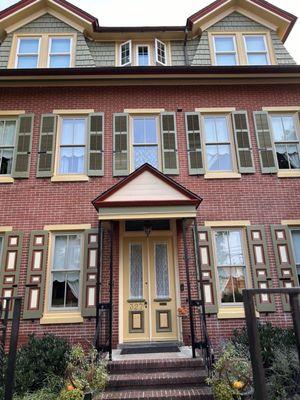 The front of our 1869 home was power washed and painted using four paint colors and a colored stain.