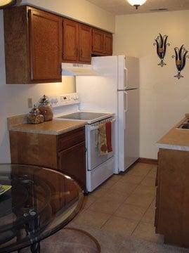 Dining area and kitchen in a two bedroom apartment.