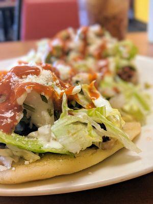 Chorizo sopes with lots of salsa roja added by me