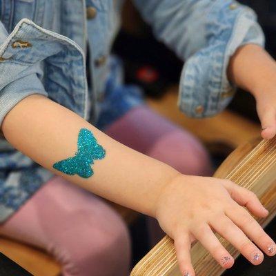 We offer glitter tattoos as and add-on to any service, in a variety of fun designs!