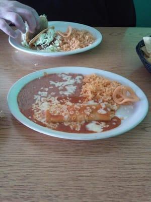 4.95 lunch cheese enchilada and 2 item shredded beef tacos