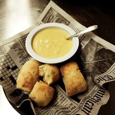 Cup of house made Broccoli & Cheddar and Roasted Red Pepper & Onion Ciabatta Bites