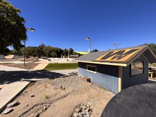 Outdoor park with logo on roof.