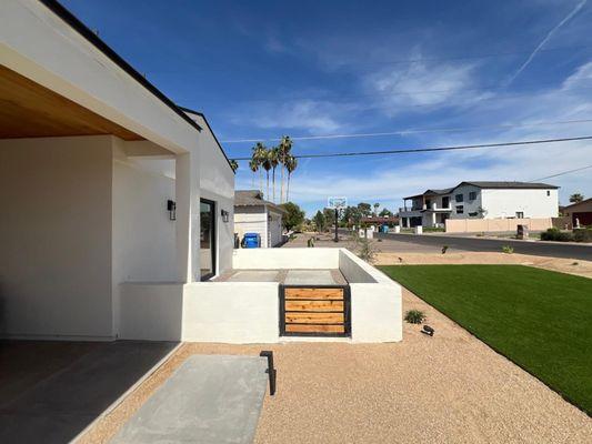 Outdoor Living:  Artificial Turf, Enclosed Patio, Custom Gate, Concrete Stepping Stones, and Modern Outdoor Lighting