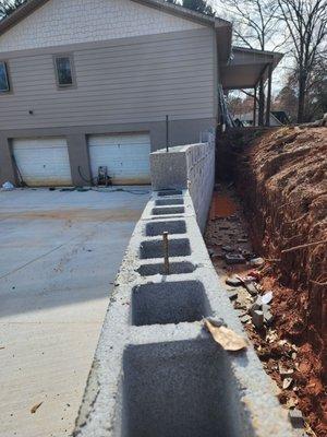 Incomplete retaining wall