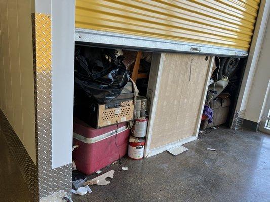 A storage unit in the climate controlled area left open with mice and bugs coming out of it.