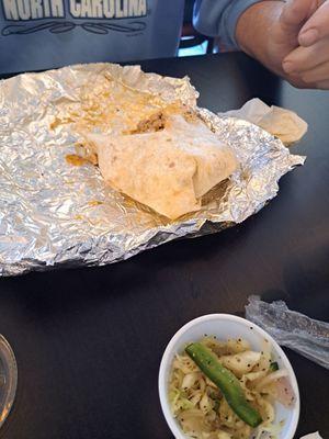 Chicken burrito with jalapeño slaw on the side