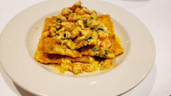 Crawfish Ravioli Fried ravioli, stuffed with Ricotta cheese, topped with crawfish tails, green onions in a spicy cream sauce