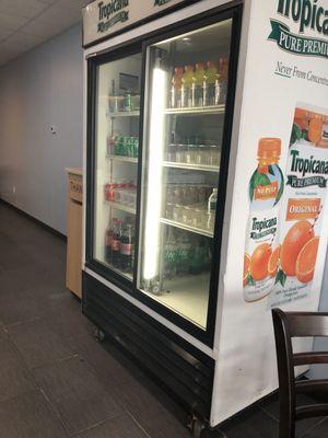 Refrigerator of drinks  with Tropicana on side