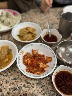 Side kimchi spices pickled veggie with slices of jalapeño i didn't ask sorry