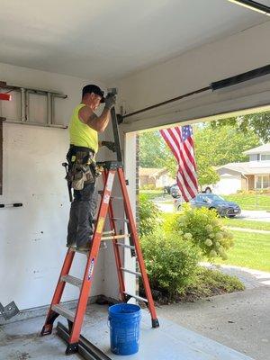 Our technician Ray installing a new torsion bar