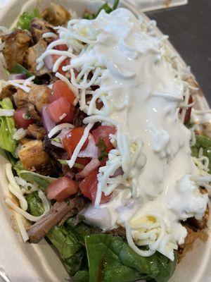 Chicken & barbacoa salad, pico, cheese, black beans, white rice & sour cream!