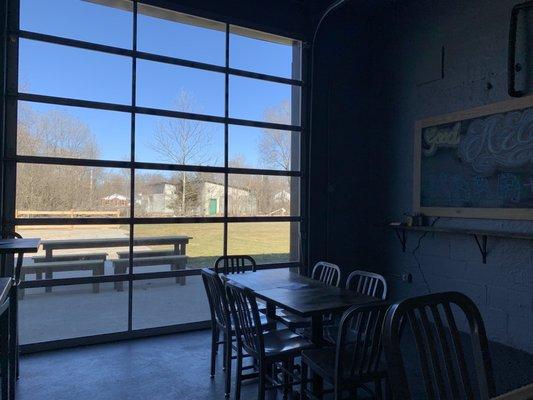 Tap room, glass garage door view of patio.