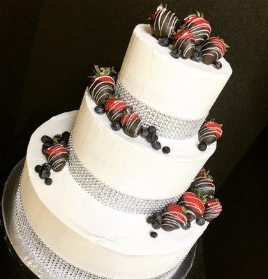 Wedding cake for a bride and groom who wanted to incorporate chocolate covered strawberries into their cake.