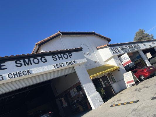 The Smog Shop. Juan friendly service with a smile.  Garage and front door. Next to alignment shop n auto service