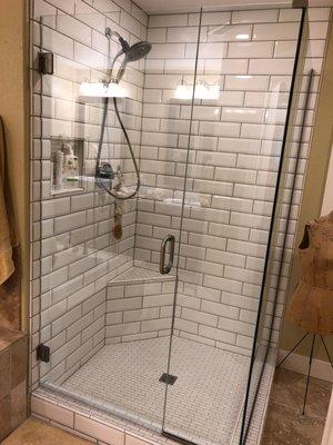 After: we demoed the old shower because of a pan leak, we repaid all the rot and installed a new tile shower.