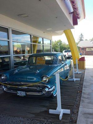 A 1957 Chevy parked right I front!