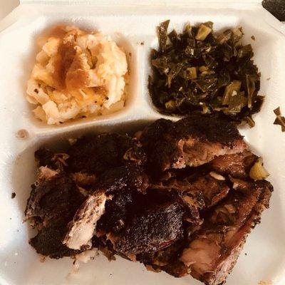 Chicken & Ribs with macaroni and cheese and collard greens.