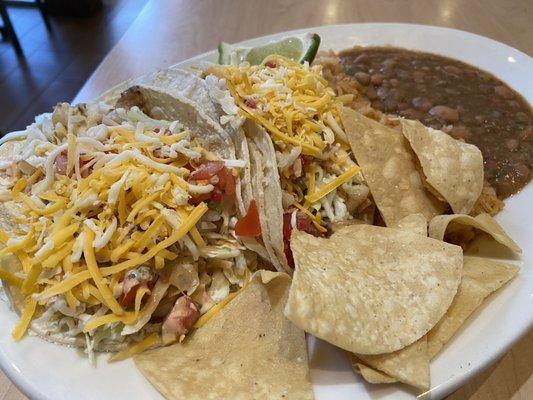 Grilled shrimp tacos, Mexican rice, pinto beans.