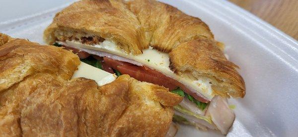 Turkey, avocado, cheese, tomato, lettuce, and mayo on a croissant...Sooo delicious!