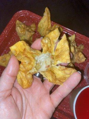 Crab Rangoon...opened and next to no filling. This is how they all were. Very skimpy ratios of filling to wrapper at this restaurant.