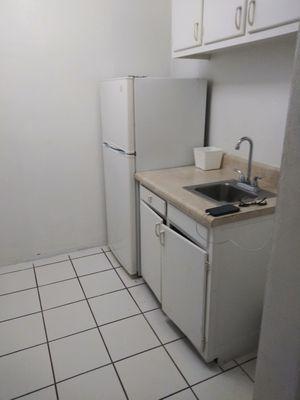 Kitchen with only a fridge