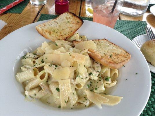 Homemade pasta with chicken in cream sauce.