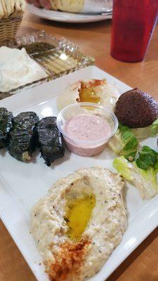 Sampler Combination of hummus, baba ghanouj, falafel and veggie grape leaves served with hot pita bread- was very good