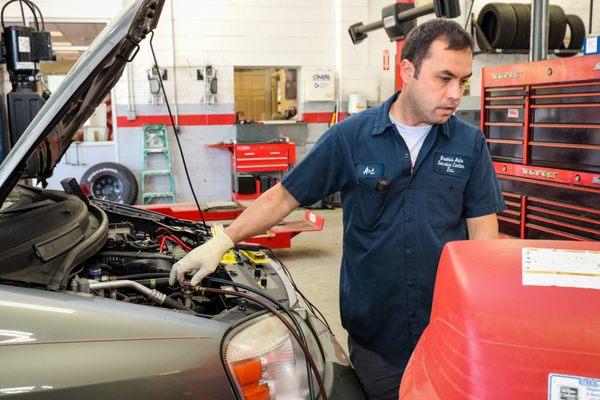 One of our technicians working on an air conditioning  system.