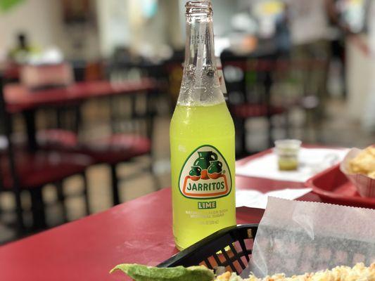 A bottle of lime Jarritos soda.