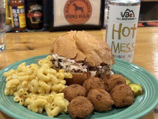 Carolina pulled pork with a side of Mac and cheese and jalapeño hushpuppies