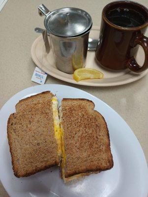 Breakfast Super Special Ham & Egg sandwich - $5, plus $1.50 for cheese.