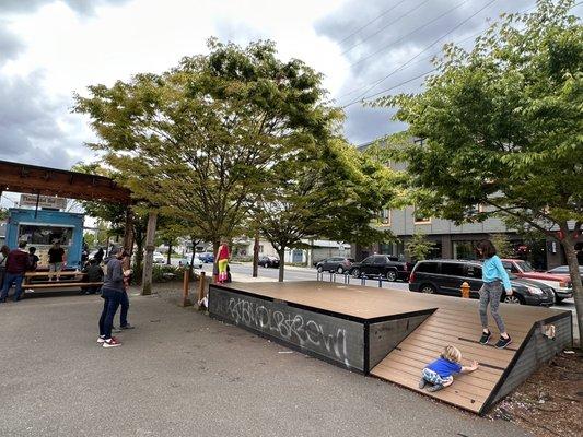 Little play area for, use it with caution since the intersection is super busy and street is right on the other side.