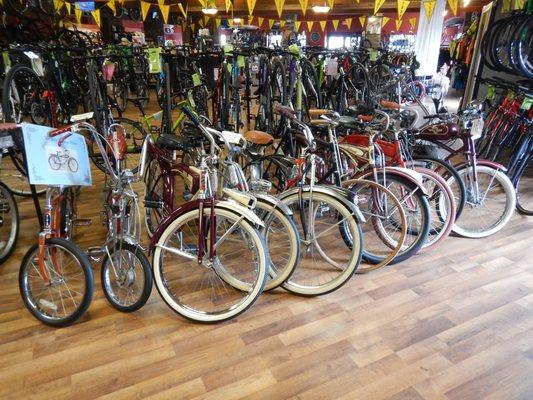 Here is a collection of bikes belonging to the owner. One has wooden wheels!