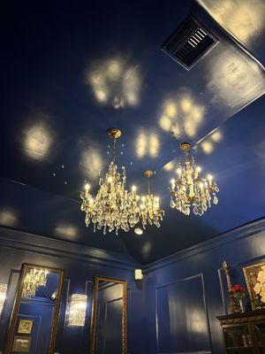 The beautiful chandeliers in the blue velvet room