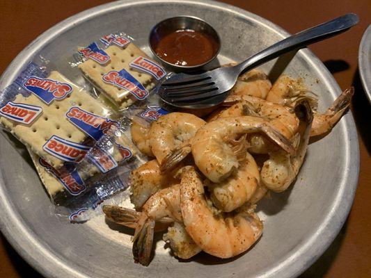 Half pound of boiled shrimp come with Cajun seasoning on them.