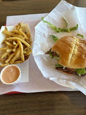 Deluxe burger with garlic fries and fry sauce.