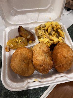 Ackee and saltfish with fried dumplings and a side of plantain